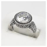 Round Cut Cz Curly-Qsterling Silver Ring. Size 7 - 7.25.