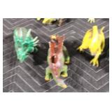 Collection of 12 Dinosaur Figurines in Various Colors