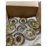 Large box lot of gold plastic wheels