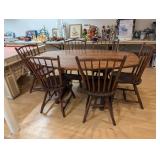 Large wood dining room table with eight chairs. 66