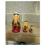 three Russian handmade nesting dolls