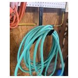 GREEN WATER HOSE AND HOLDER / BRACKET