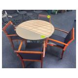 Round-top pedestal table with 4 arm chairs