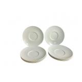 Set of Six White Ceramic Saucers with Circular Des