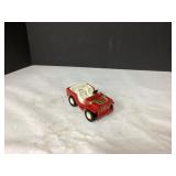 Red Toy Jeep with White Seats and Rainbow Striped