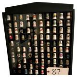 THIMBLE COLLECTION IN WOODEN DISPLAY CABINET - APPROX. 99 TOTAL - MOSTLY PORCELAIN, SOME PEWTER - BRITISH, BUSCH GARDENS, CANADA, PLAYING CARDS, TENNESSEE, GREAT SMOKY MOUNTAINS, ETC.