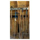 HAND TOOL LOT: PITCH FORK, RAKES, SMALL CULTIVATOR, PICKAXE, AXE, SPADE SHOVEL, ETC.