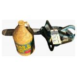 VINTAGE HOMELITE 150 AUTOMATIC CHAINSAW (UNTESTED) W/ APPROX. 1/4 BOTTLE OF BAR AND CHAIN OIL