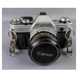 Canon AE-1 35 mm Camera Including Macro Zoom Lens, Extension Tube, Speedlite 155A, And Carrying Case