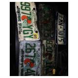 5 vintage license plates.