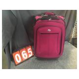 Pink american tourister suitcase