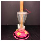 Plastic hummingbird feeder