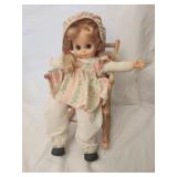 Vintage rocking chair with doll