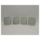 Lot of 4 small plant pots with saucers