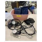 Assorted blood pressure cuffs,  ice and heat pads