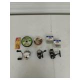 Assorted fishing reels, fishing line, and hooks