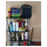 Four tier shelf with contents, including irons,