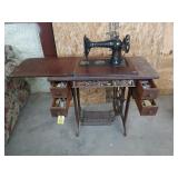 Singer treadle sewing machine with lots of