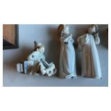 Three porcelain figures, one yard roll clown, and