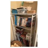 5 ft metal shelf unit with the books and other