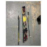 Nordica skis with two sets of ski poles