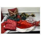 Assorted Christmas decor including tree skirt,