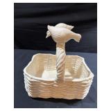 White ceramic basket with geese on top of handle