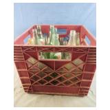 Vintage crate of glass bottles including 7 UP, RC