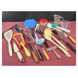 Assorted kitchen utensils and measuring cups,