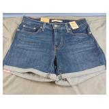 Levi Strauss & Co. Mid-Length blue jean shorts.