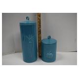 Two Turquoise Colored Canisters With Lids