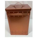 Copper colored cookie jar tin