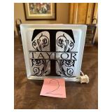 Lighted glass tile with the name Taylor on it.