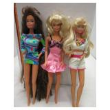 Three Barbie dolls