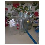 Collection of Assorted Glass Bottles and Jars