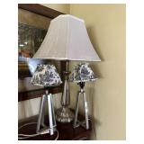 Three chrome table lamps with shades