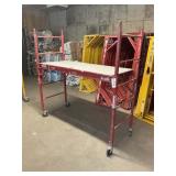 RED SCAFFOLDING COMPONENTS INCLUDING 2 FULL BUCKS