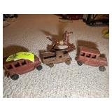 GROUP OF CAST IRON TRUCKS AND HOBBY HORSE