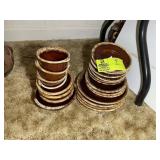 GROUP OF BROWN HULL, PLATES, SAUCERS, AND BOWLS