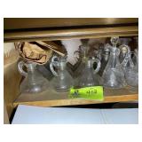 GROUP OF OIL AND VINEGAR BOTTLES, SOME MISSING STO