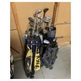 Assorted golf clubs and bags