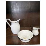 Antique white blue and black enamelware pitchers