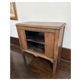 Small table with hidden storage compartment in