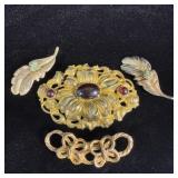 Vintage brass brooches