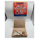 Vintage ideal xylophone and music book