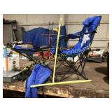 Blue folding camp chair with foot rest and