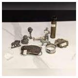 OLD COLLECTIBLE TRINKETS INCLUDING LEAD SOLDIER, 20 MM SHELL CASING, DOG FIGURES, AND MORE