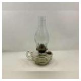 Clear glass oil lamp with chimney, see pictures for details.