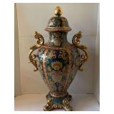 VINTAGE LARGE ITALIAN PORCELAIN LIDDED URN 25" TALL X 15" WIDE - SHADES OF NAVY, WINE, GREEN WITH GOLD ACCENTS - HANDLES ARE PAINTED GOLD AND HAVE 4 GOLD LION HEADS ON FEET - FOYER