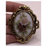 VINTAGE GOLDTONE OVAL BROOCH WITH CERAMIC HANDPAINTED ROSE CENTER 2 1/2" LONG